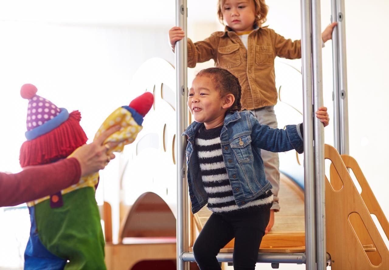 Child enjoying a bubble play activity at Gymboree