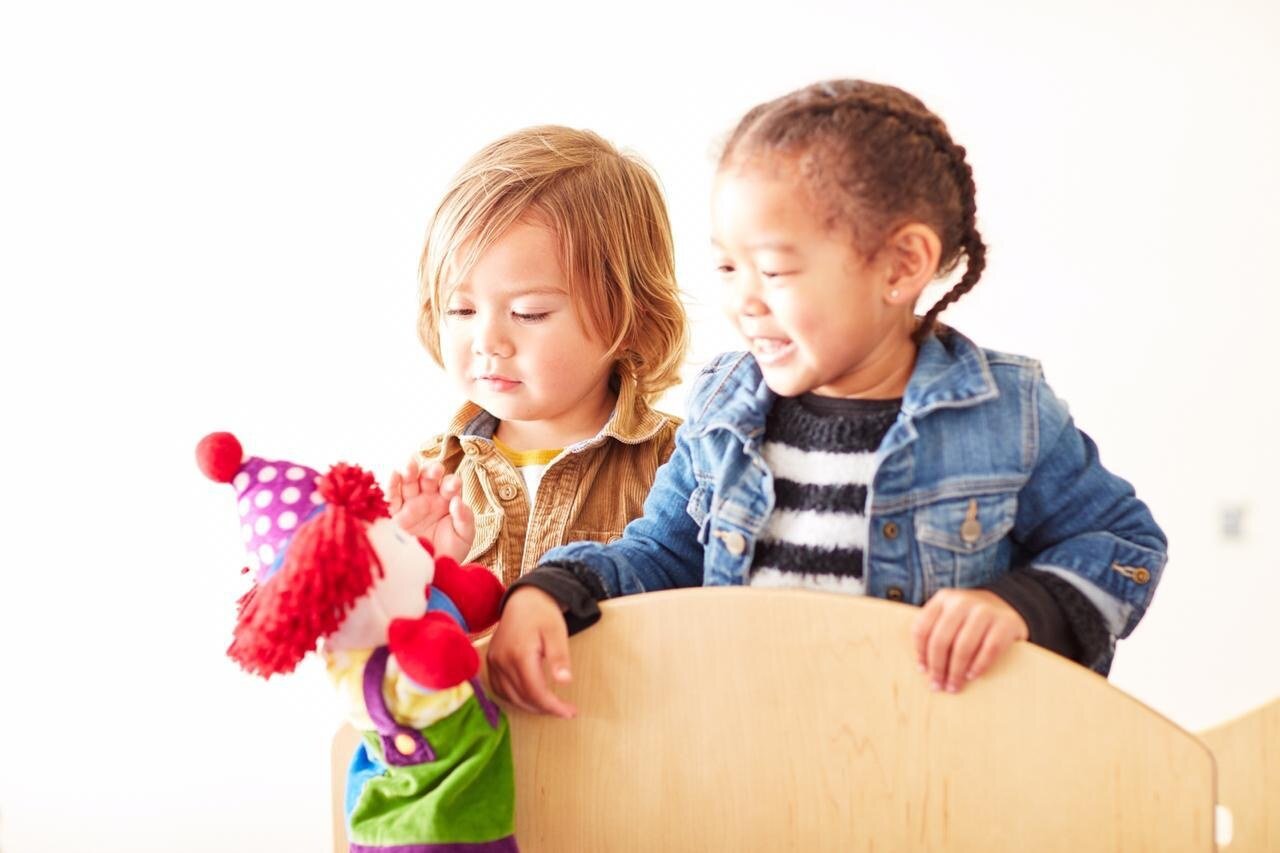 Children enjoying a puppet play activity