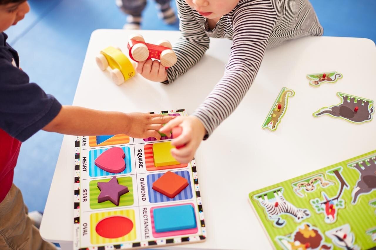 Hands-on puzzle learning activity at Gymboree